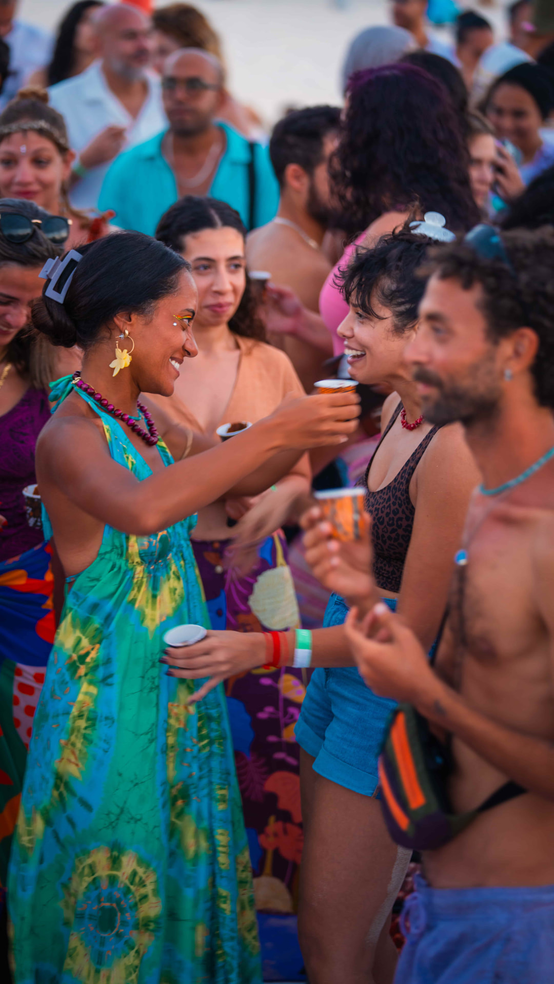Guests gathered together at a Sukun festival at sunset